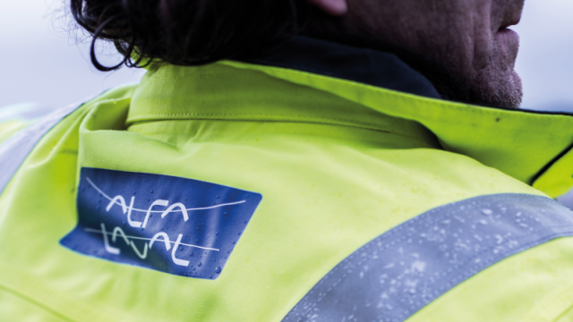 Man wearing a jacket with Alfa Laval logotype