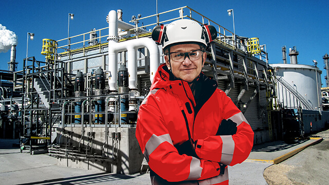 Engineer outside in front of a wet surface air cooler system